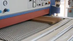 wide sanding belts in a woodworking sanding machine